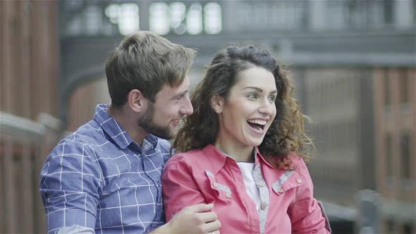 Couple watching amusing sight outdoors