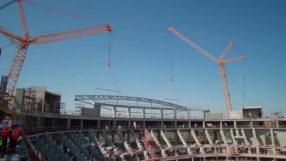 Tower Cranes Lift Roof Detail at Stadium Construction Site