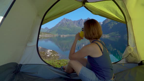 Happy Woman Sitting in a Tent