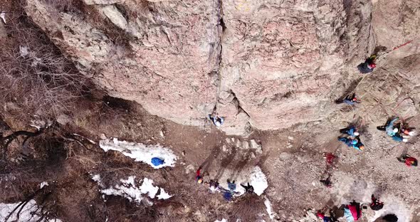 A Group of People are Engaged in Rock Climbing