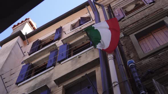 Italian Flag Waving on the Balcony of the House
