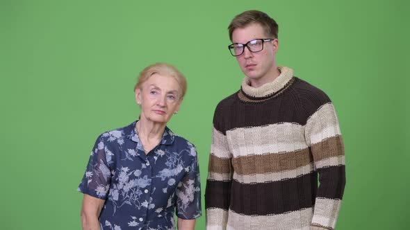 Grandmother and Grandson Thinking While Waiting Together