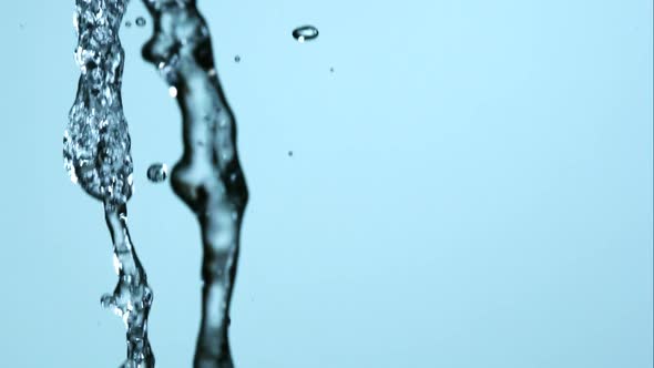 Water pouring and splashing in ultra slow motion 