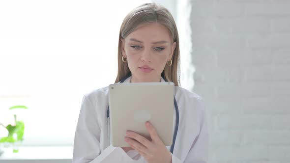 Portrait of Lady Doctor Using Tablet in Office