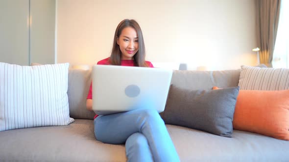 Young asian woman use laptop