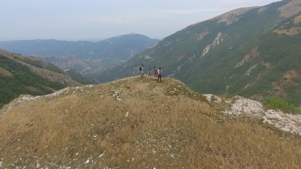 Group of four friends hiking in Umbria, Italy