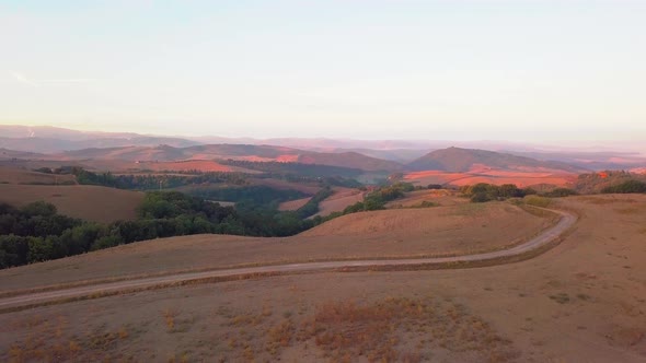 Aerial View of Tuscany Cultivated Hills at Sunrise Val D'orcia