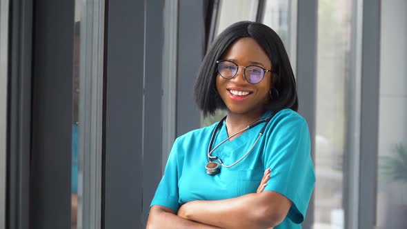 Happy Young African American Woman Doctor with Stethoscope Looking at Camera. Smiling Female