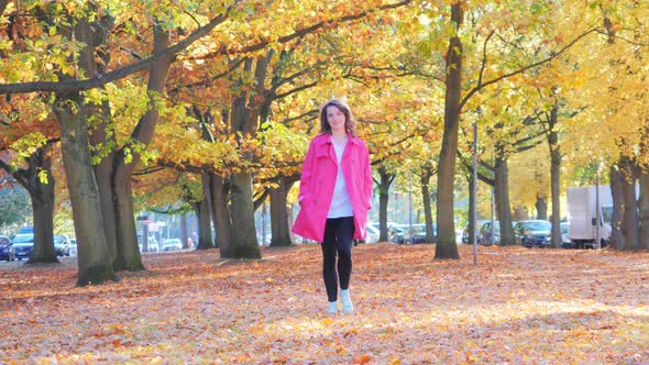 Happy Woman Walking in Fall Park, Trees with Autumn Leaves