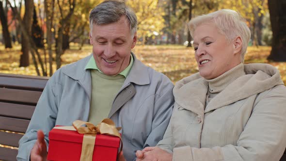 Portrait Elderly Man Rejoices Gift Surprise Mature Grandpa Throwing Red Box Feel Happy Married