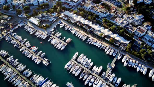 View from drone on full of yachts Bodrum harbour and ancient Kalesi castle in Mugla in Turkey