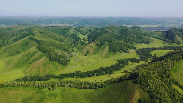 Flight Over Green Hills Meadows Valleys and Forests