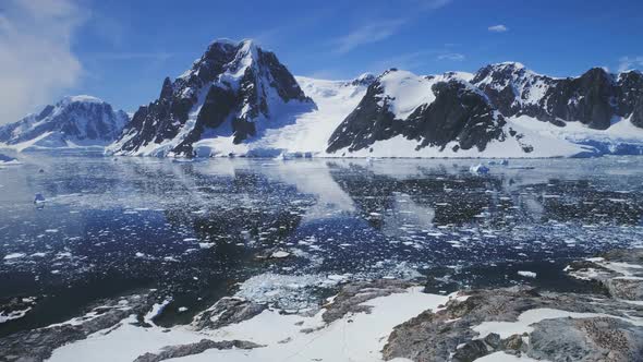 Antarctica Ocean, Snow Mounts. Aerial Flight.