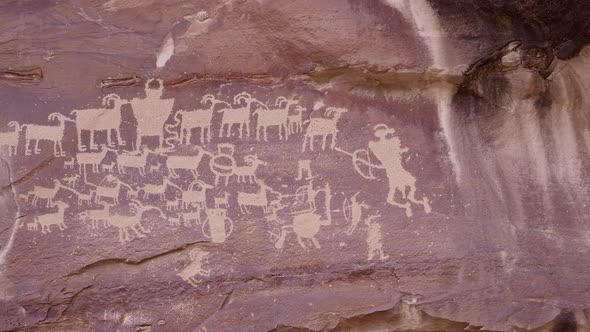 Close up panning view of The Great Hunt panel petroglyphs