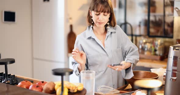 Housewife Prepares Dough for Baking Waffles at Home