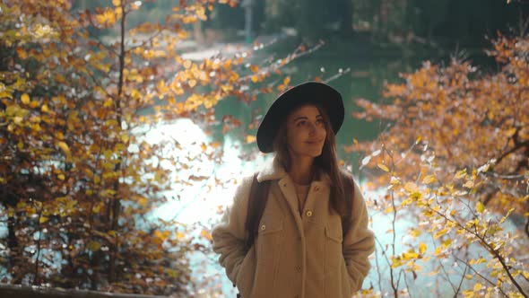 Closeup Cheerful Ukrainian Woman Tourist on Trail in Fall Forest on Sunny Autumn Day