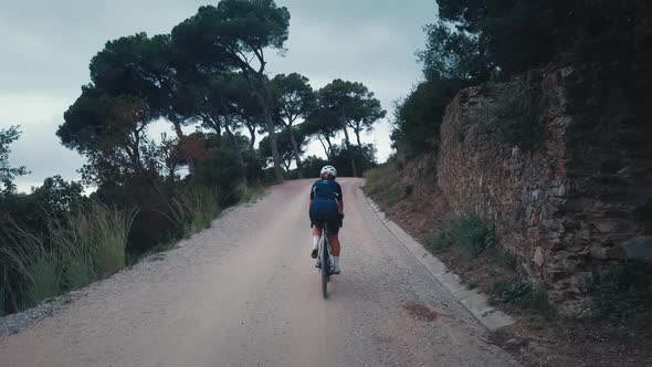 Fit Young Woman Ride Gravel Bike on Forest Road