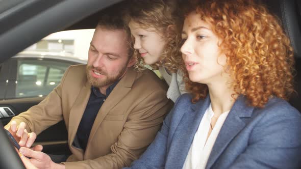 Happy Caucasian Family Try New Car From Inside