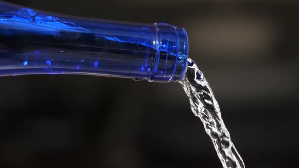 Water Pouring From a glass Bottle