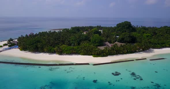 Tropical fly over travel shot of a summer white paradise sand beach and blue ocean background 