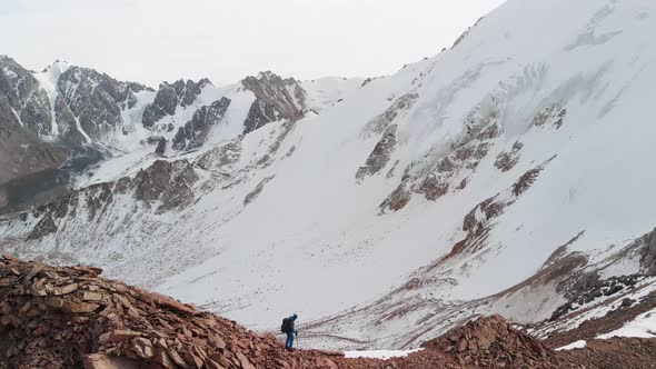 Man Walking at the Mountain Summit Aerial Landscape