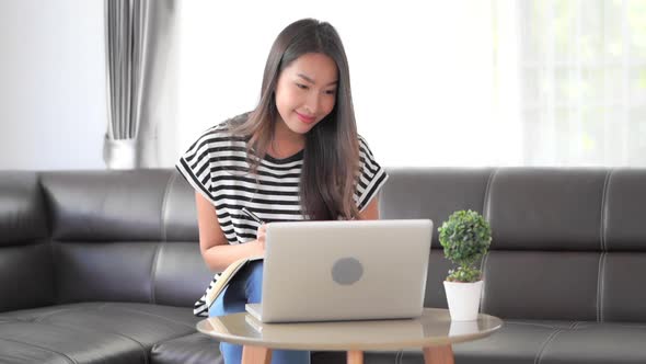 Young asian woman use laptop