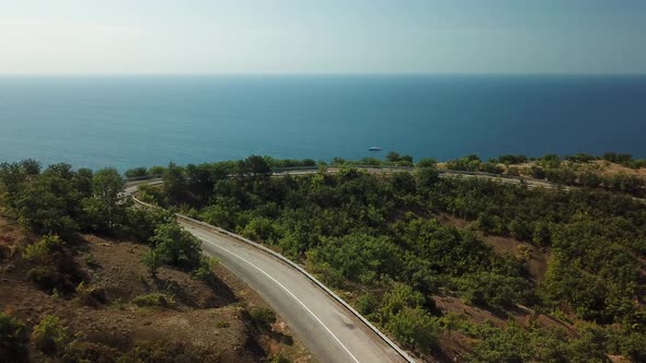 A Winding Road Through the Crimean Mountains Along the Sea