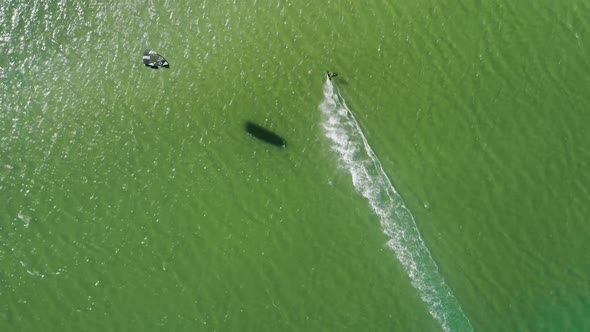 Male Kiteboarder Training in Ocean at Alvor Beach Portugal Europe