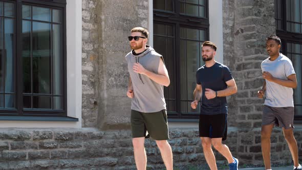 Young Men or Male Friends Running Outdoors
