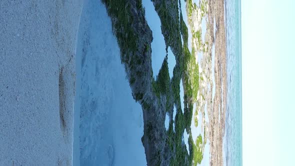 Vertical Video of Low Tide in the Ocean Near the Coast of Zanzibar Tanzania Aerial View