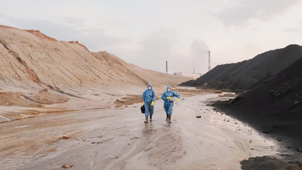 Ecology Experts Walking Along Polluted City