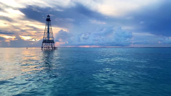 Amazing clip with beautiful colors of the ocean and the clouds in Alligator Reef Light House (Islamo