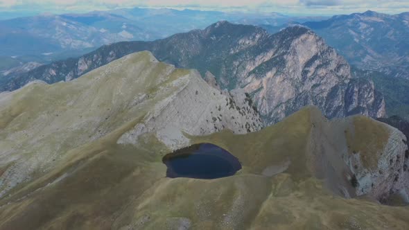 Aerial view of top of Tymfi and Smolikas mountain, Drakolimni lake