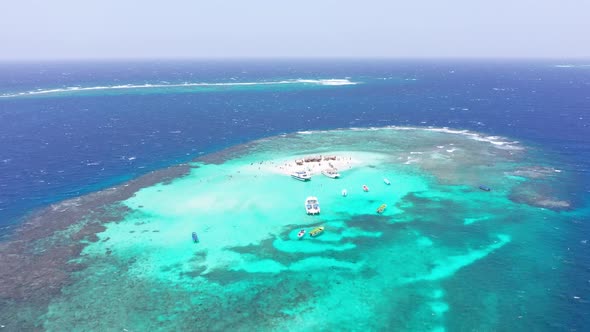 Colors contrast of surrounding waters Cayo Arena or Paradise island in Dominican Republic. Aerial fo