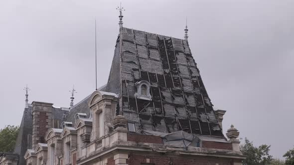 damaged and broken castle roof being repaired