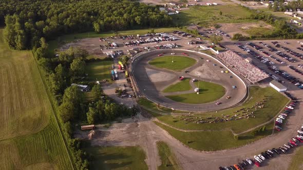 Cars Racing On The Race Track In Ash Township, Michigan. Flat Rock Speedway On A Sunny Day. aerial