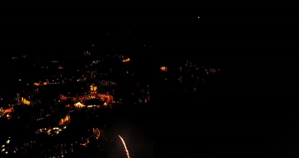 Aerial of fireworks celebration above ski resort.