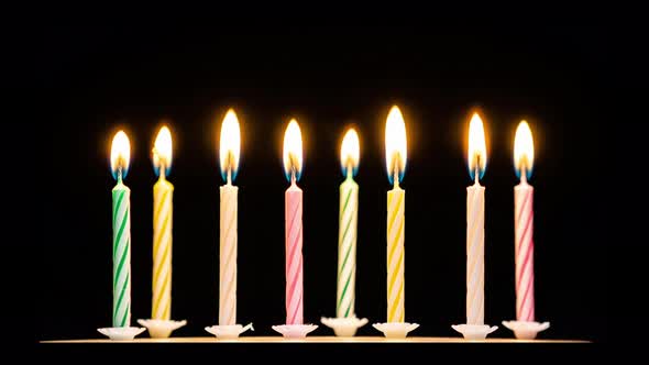 Timelapse of birthday candles burning alt