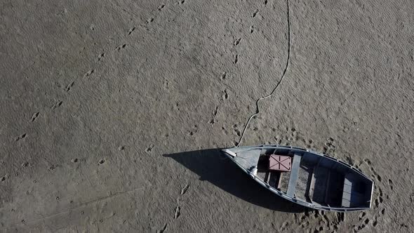 Top View of Boat at the Shore of Dried Up Sea Global Warming and Drought Concept