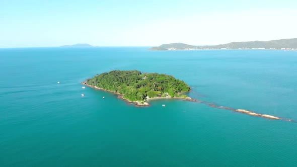 Aerial Shot of Beautiful Island in Atlantic Ocean in Florianopolis, Brazil. Camera Moving to the Rig