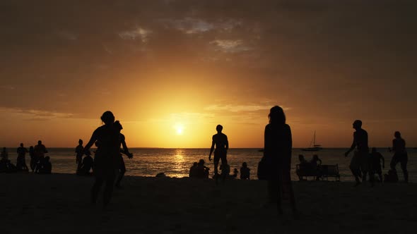 Silhouettes of People Playing Beach Volleyball at Sunset Slow Motion Zanzibar