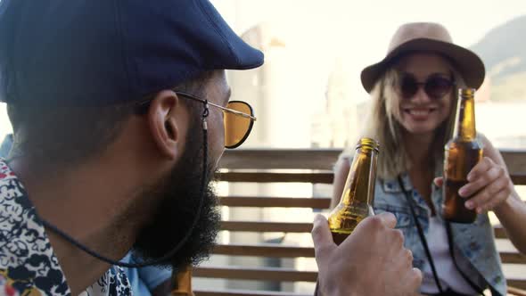 Young adult friends hanging out on a rooftop