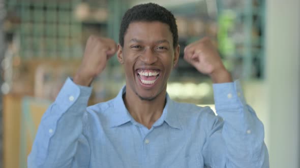 Ambitious Young African Man Celebrating Success