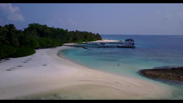 Aerial drone view panorama of idyllic sea view beach voyage by blue ocean and white sandy background