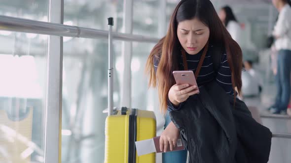 Young traveler female feeling upset and bored at airport