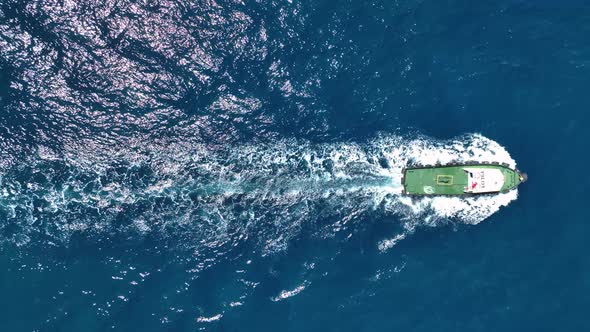 Tug boat sails in port aerial view 4 K Turkey Alanya