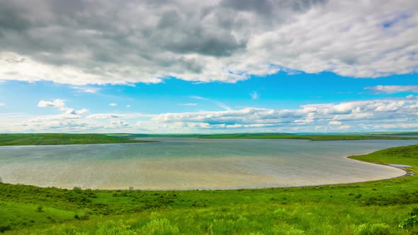 White Fluffy Clouds over the Lake