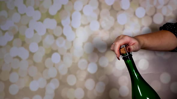 A champagne bottle being opened and popping out and flying across the room