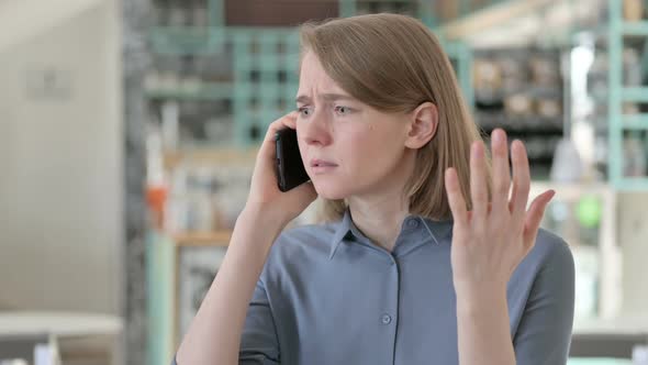 Portrait of Young Woman Angry on Smartphone Call