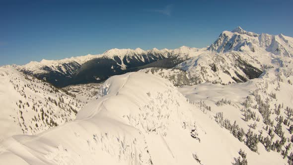 Spectacular Helicopter Aerial 4k Footage Flying Over Table Mountain Top Skiers Towards Mount Baker